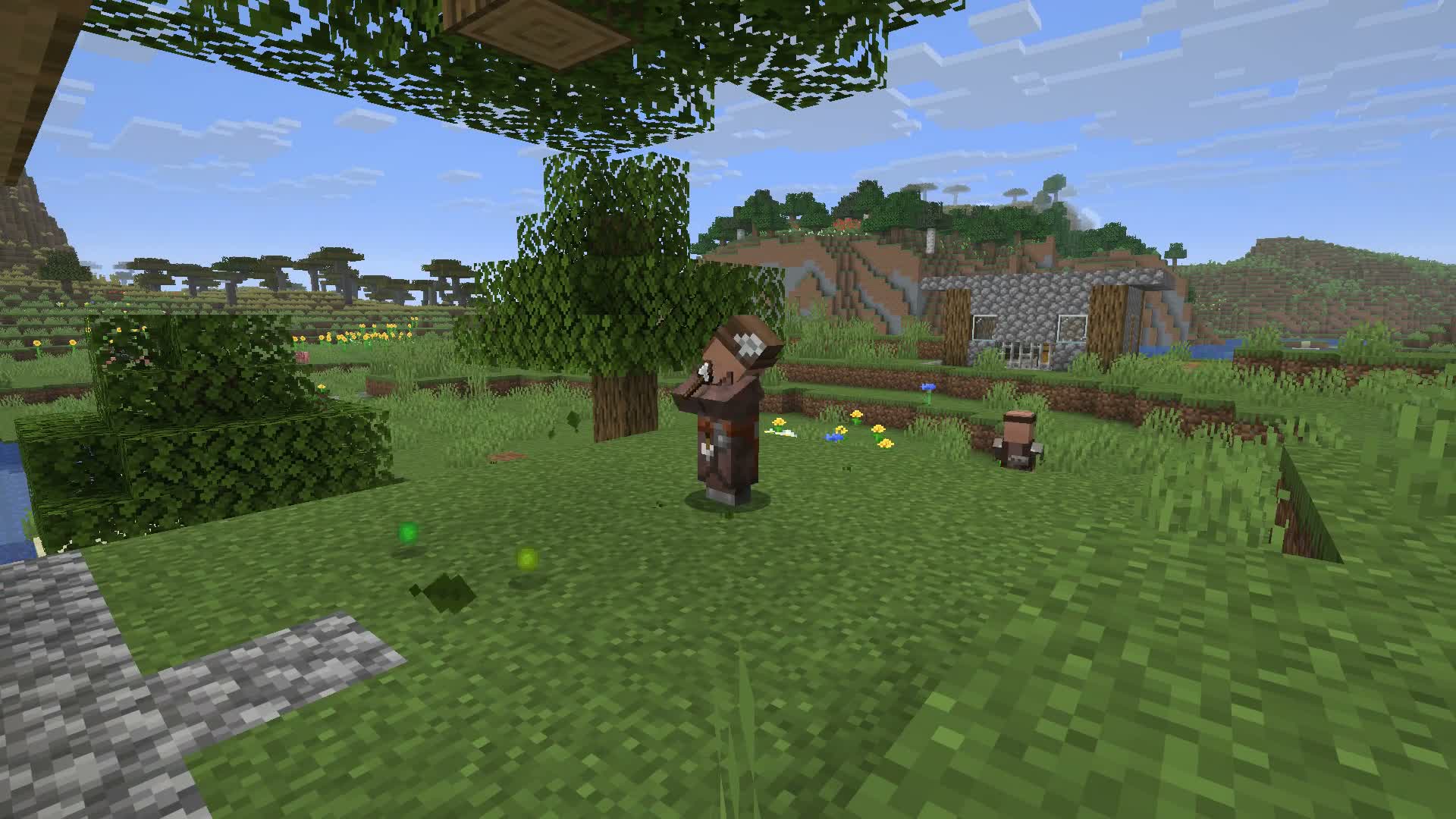 A Forester harvesting a tree beside the village, with an axe in hand